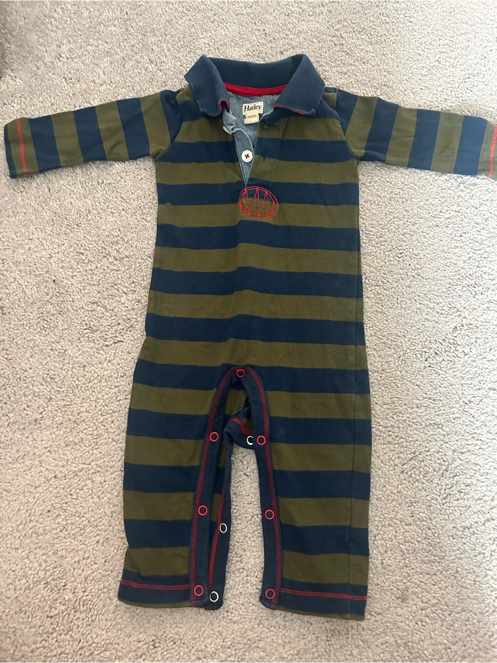 Hatley striped polo romper featuring a collared neckline and red accent